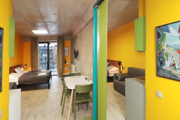 A cheerful entrance decorated in vibrant green and bright yellow!