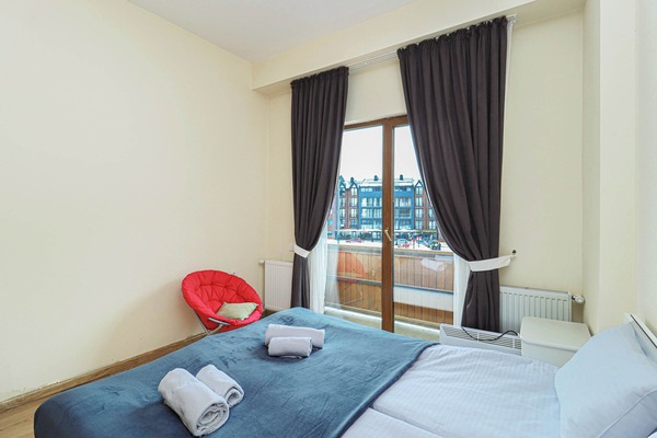 Fresh linens are neatly placed on the bed, creating a restful sleeping area.