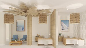 A modern, minimalist room with a wooden desk, two blue chairs, a white sofa, and a large abstract painting on the wall. - Urania Arenal by Soho Boutique (Llucmajor)