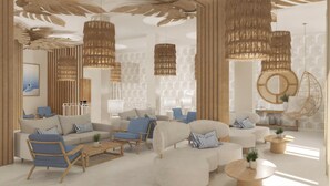 A modern living room with a sofa set, blue armchairs, and hanging rattan chandeliers. - Urania Arenal by Soho Boutique (Llucmajor)
