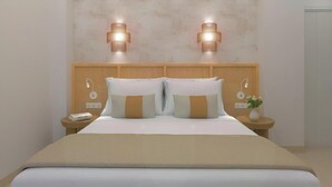 A hotel room with a wooden headboard, two wall-mounted lights, a bedside table with a phone, and a vase with flowers. - Urania Arenal by Soho Boutique (Llucmajor)
