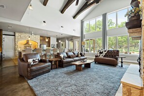 TV, fireplace, table football - Private Resort w/ Pool & Spa, Theater Room, Outdoor Kitchen & Game Spaces (Wimberley)