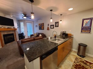 Interior - Modern 1 bedroom with private balcony offering mountain views, bedroom with fire (Winter Park)