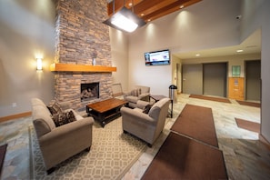 Interior - Modern 1 bedroom with private balcony offering mountain views, bedroom with fire (Winter Park)