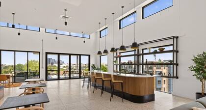 Modern, light-filled 2BR in Charlotte’s vibrant South End. Steps to the Rail Trail + Light Rail for easy Uptown access. Rooftop skyline views, luxe co-working, and walkable hotspots. Perfect for work, play, or extended stays.