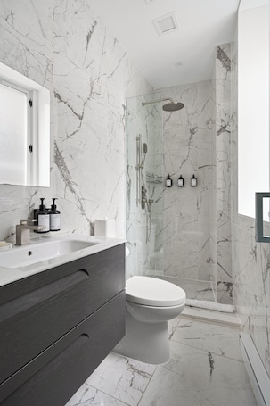 Hair dryer, towels, soap, shampoo. The Bowery Lofts Hotel