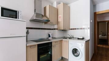 Fridge, microwave, stovetop, cookware/dishes/utensils