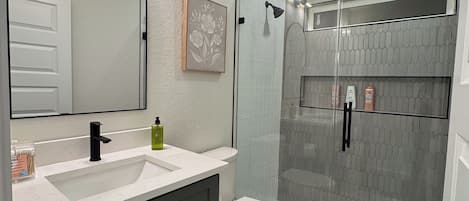 Shower, hair dryer, towels, soap