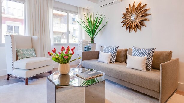 A modern living room with a sofa, armchair, and a coffee table. - General Pardiñas III (Madrid)
