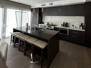 Fridge, stovetop, cookware/dishes/utensils, dining tables