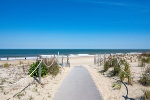 A beach pathway leading to the ocean with a clear sky. - 70 Steps to the Sand • 2BR/1BA • 2 Balconies • Sleeps 6 (Dewey Beach)