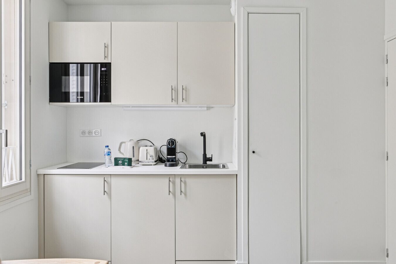 Fridge, microwave, stovetop, coffee/tea maker