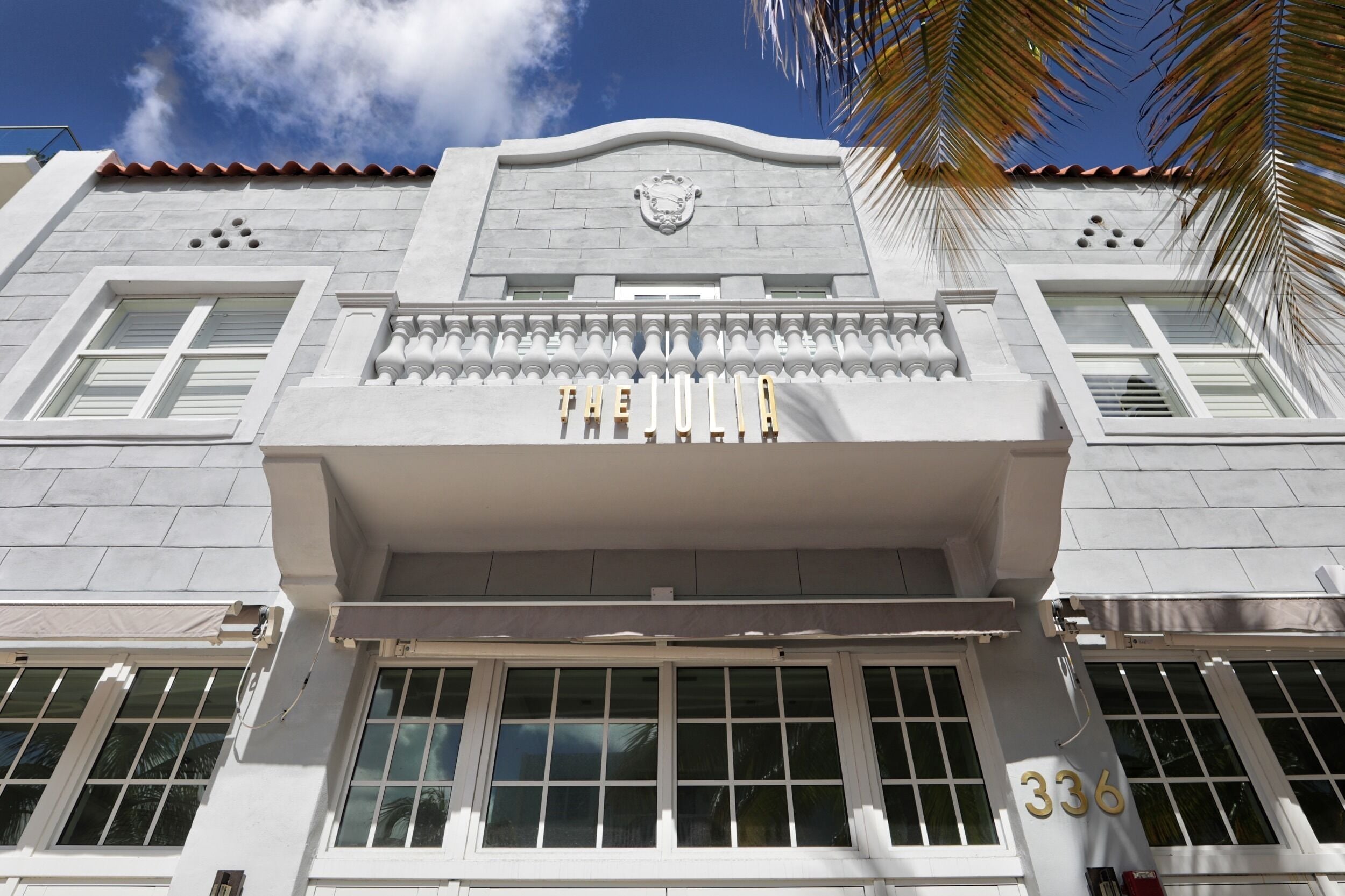 A building facade with a prominent sign reading "THE JOLIA" and the number "336" below it.