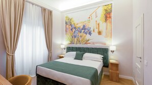 A hotel room with a bed, a chair, a painting of a street scene, and a nightstand with a lamp. - Hotel Settefiori (Florence)
