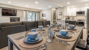 A modern kitchen with white cabinets, a built-in oven, and a microwave. - Snowcreek IV 559 | Dog Friendly (Mammoth Lakes)