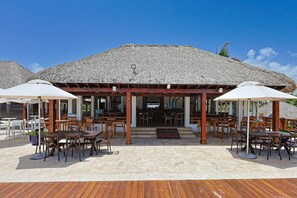 Outdoor dining - Spacious and Elegant 2BR Condo, King size Bed, Full AC, Pool, Steps to Hard Rock (Punta Cana)