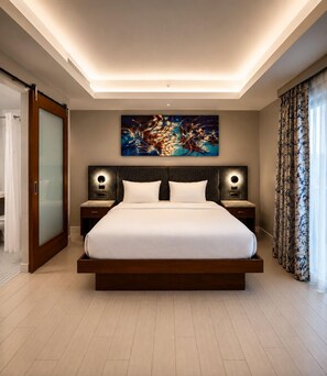 A modern hotel room with a large bed, wooden headboard, two bedside tables with lamps, a painting on the wall, and a sliding door closet. - Spacious Modern Studio • Pool & Balcony • Circ Hotel (Hollywood)