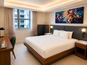 A modern hotel room with a large bed, bedside tables, a desk, and a window with curtains. - Stylish Studio with Pool. Circ Hotel Getaway (Hollywood)