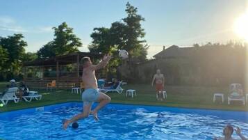 Seasonal outdoor pool, pool umbrellas, pool loungers