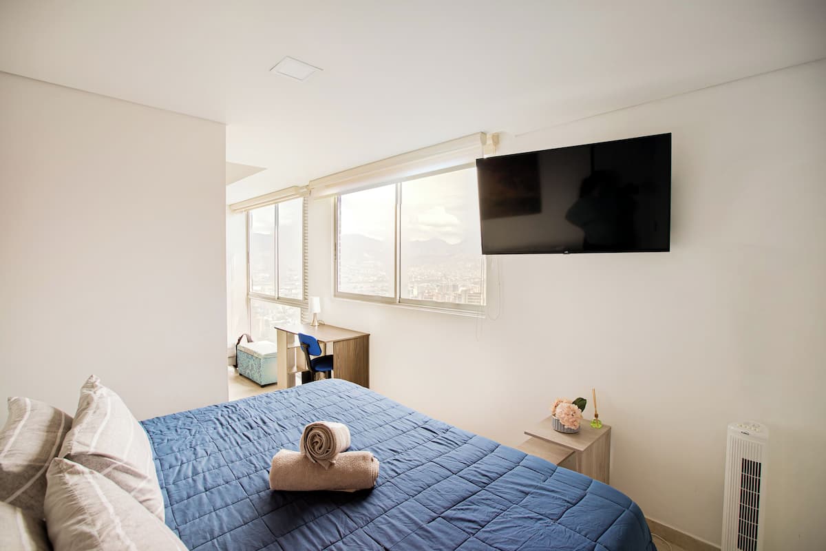 Standard Apartment, City View | Desk, laptop workspace, blackout curtains, iron/ironing board