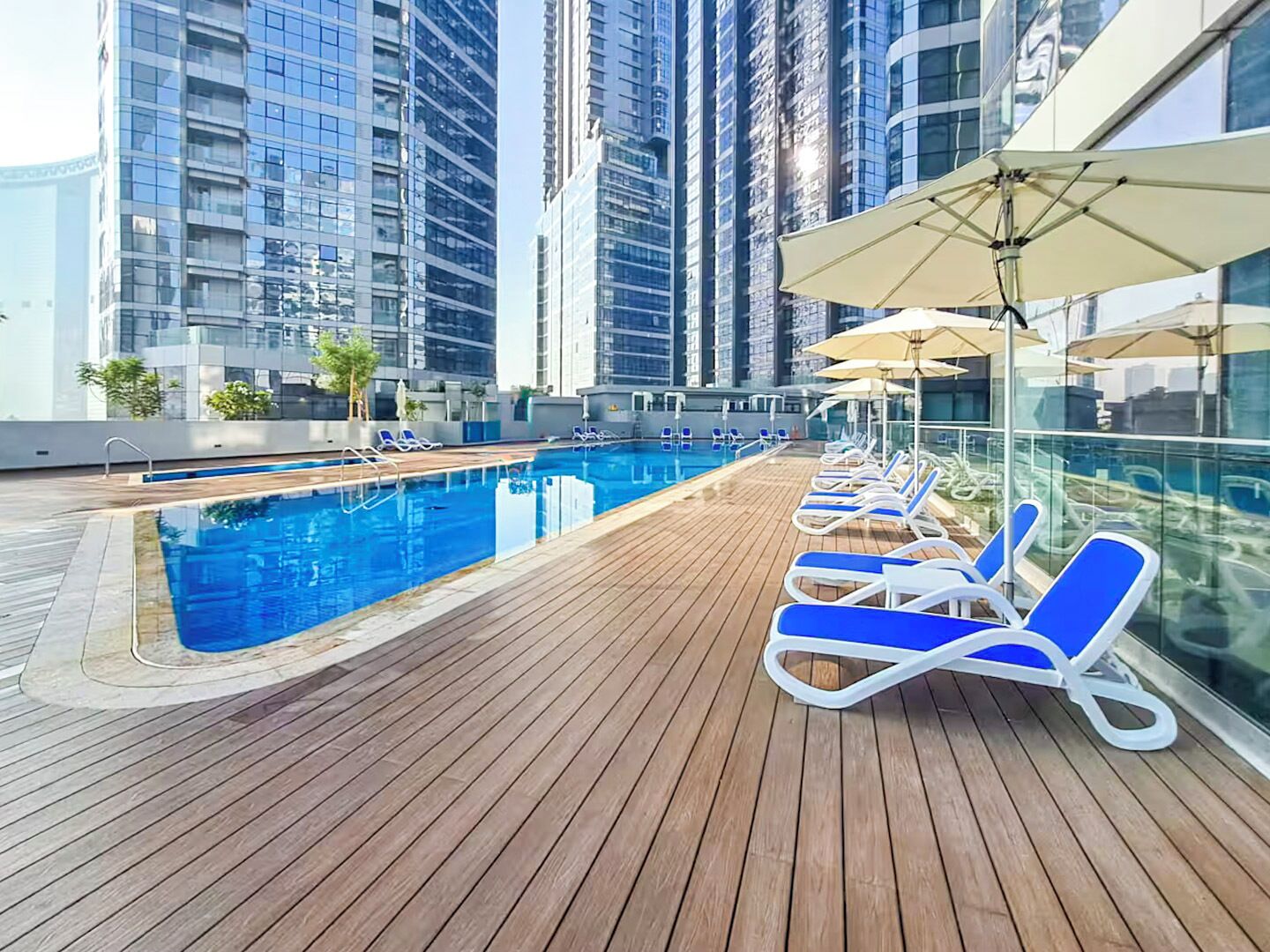 Outdoor pool, pool umbrellas, sun loungers