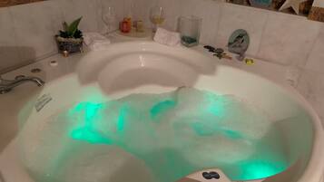 Jetted bath, towels, soap, toilet paper