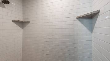Shower, hair dryer, towels, toilet paper