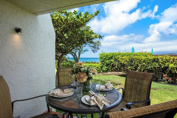 Morning coffee or twilight wine? This floral-topped lanai delivers ocean breezes and a front-row view of aloha    NAP-A25 - Napili Point | Oceanfront 3 BR, Sleeps 12 | Car Incl. w/ 6+ Nights | NAP ML-2576 by KBM (Lahaina)