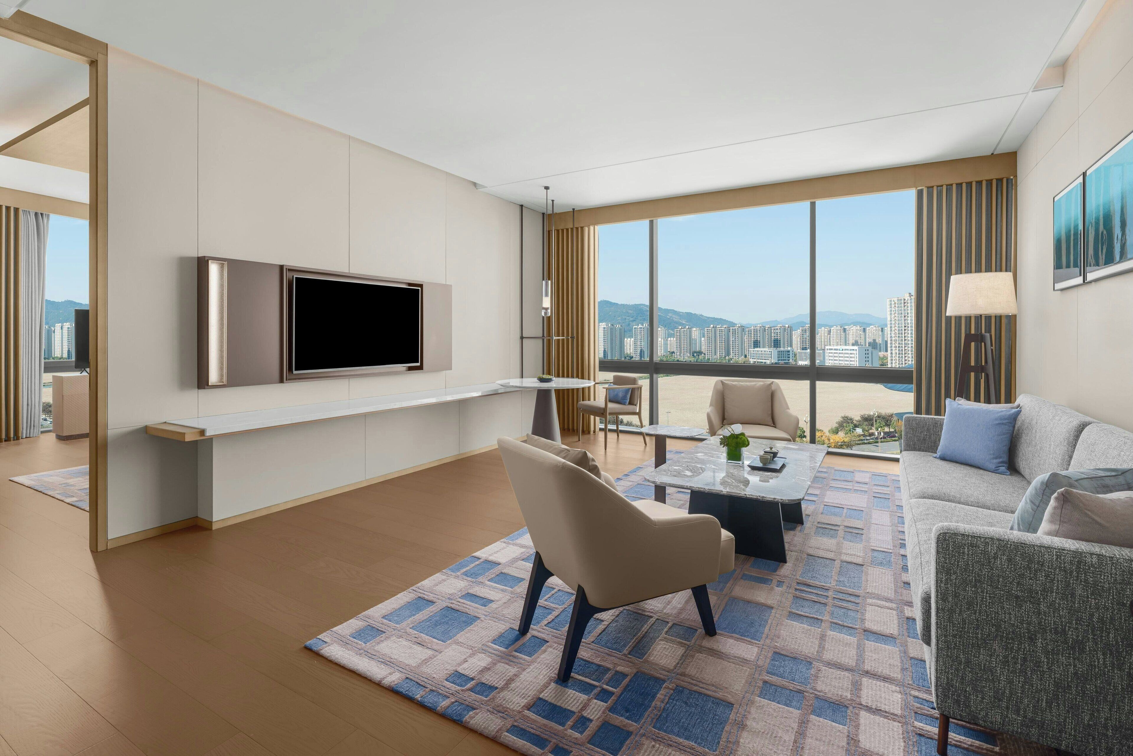 Deluxe Suite, 1 King Bed, City View | Down comforters, minibar, in-room safe, individually furnished