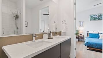Shower, hair dryer, towels, soap