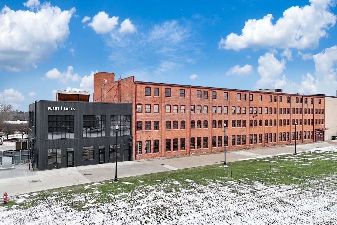 A large building with a sign reading 'PLANT | LOFTS'.