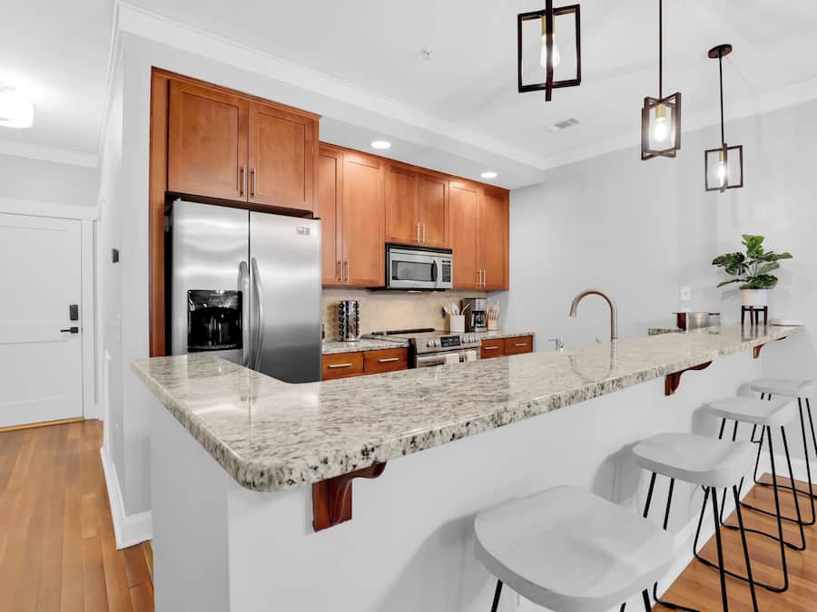 2 Bedroom Deluxe Suite | Private kitchen | Full-size fridge, oven, coffee/tea maker, cleaning supplies