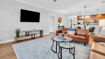 2BDR | Living area | 65-inch flat-screen TV with digital channels