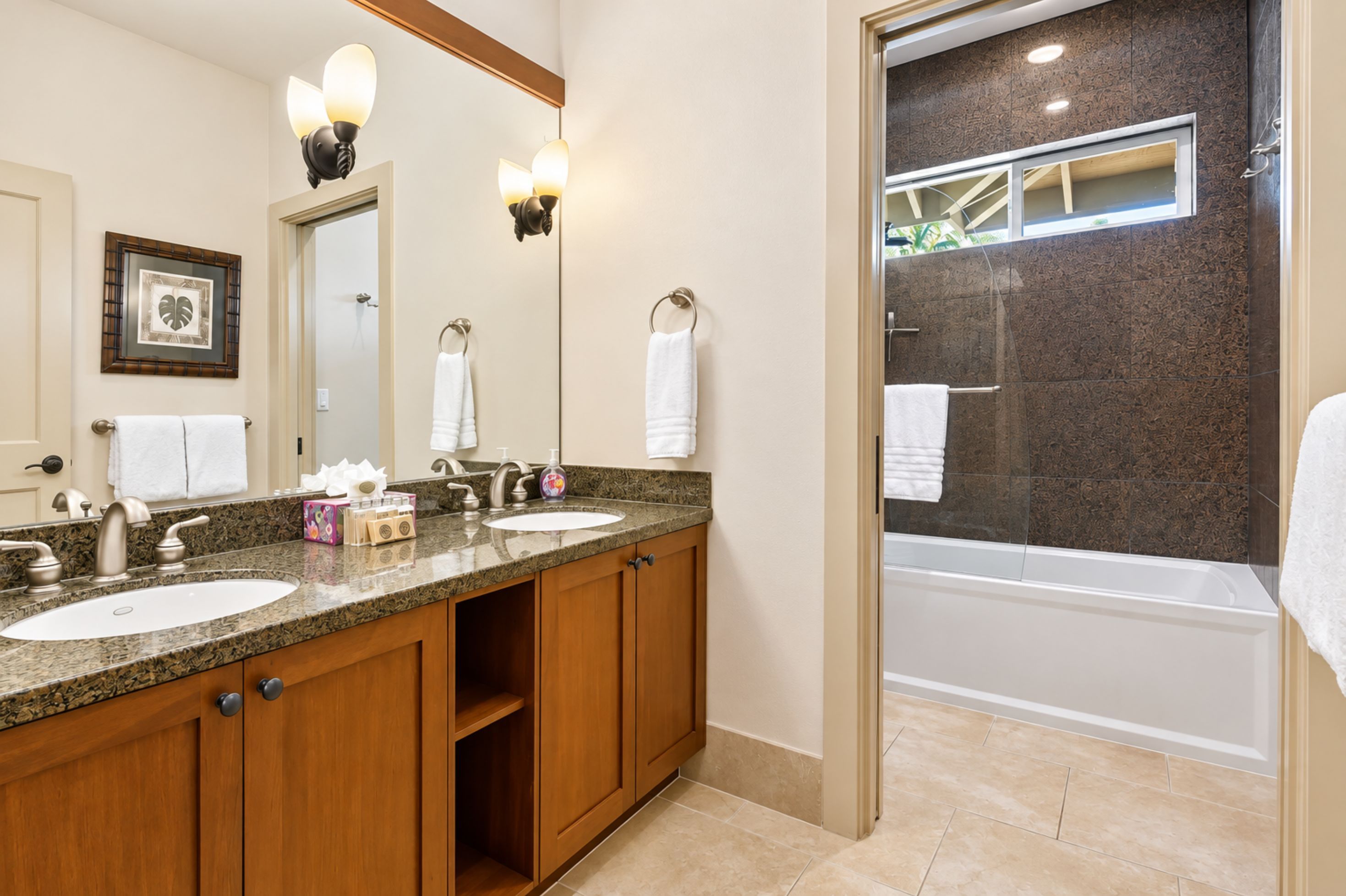 This guest bathroom provides its own vanity and bathing area, giving guests a comfortable, private space to get ready. HLI-12A