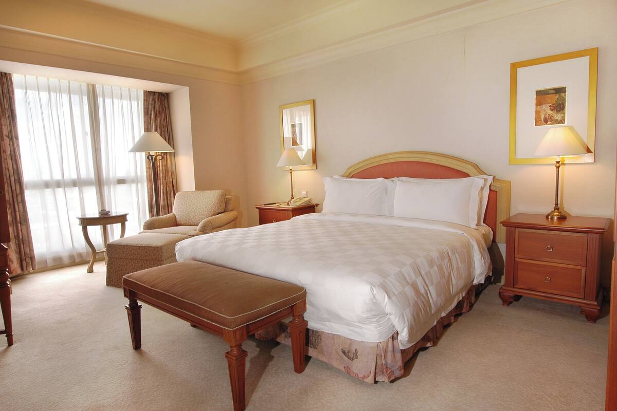 Luxury Suite, Pool View | In-room safe, desk, iron/ironing board, free WiFi