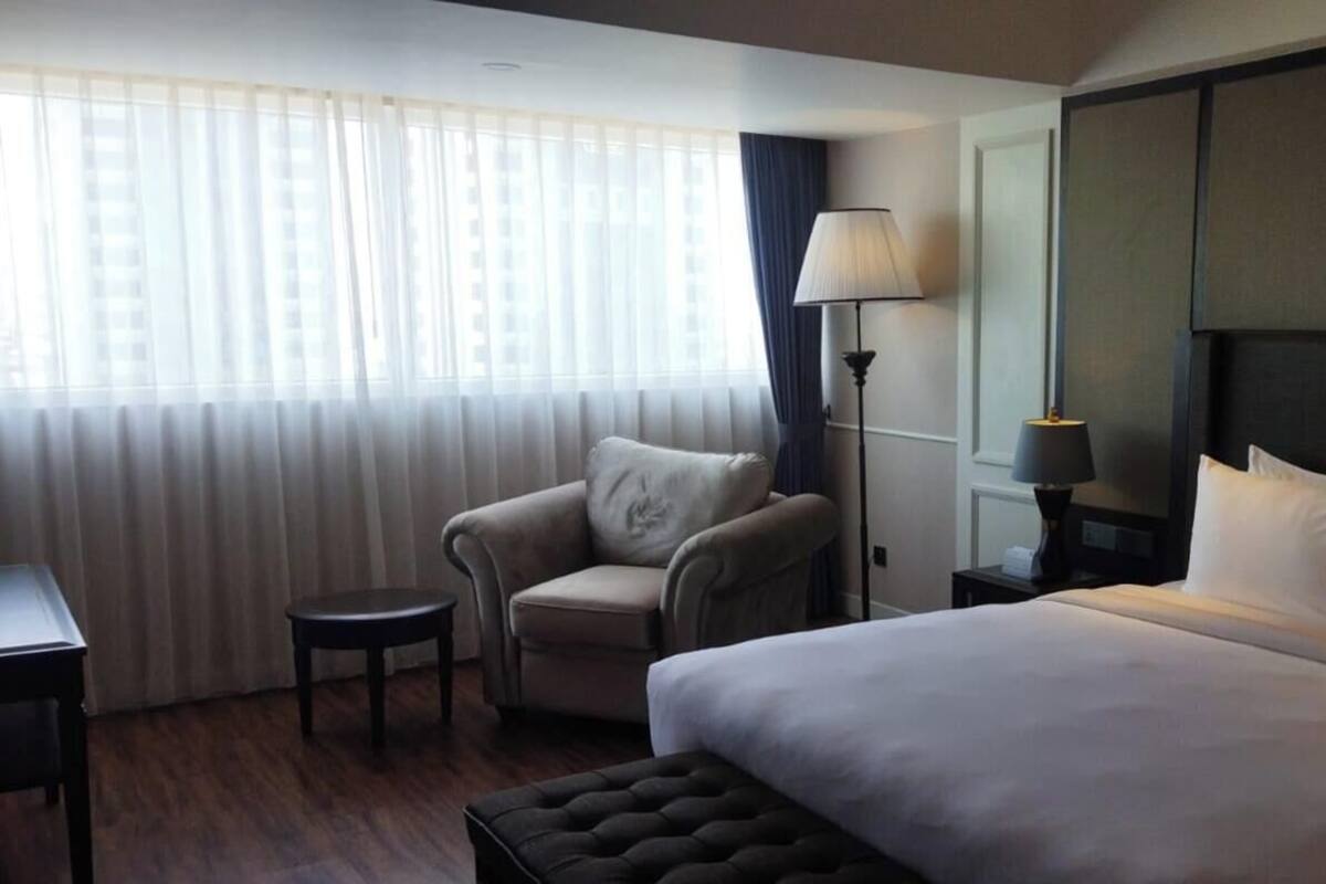 Deluxe Suite, City View | In-room safe, desk, iron/ironing board, free WiFi