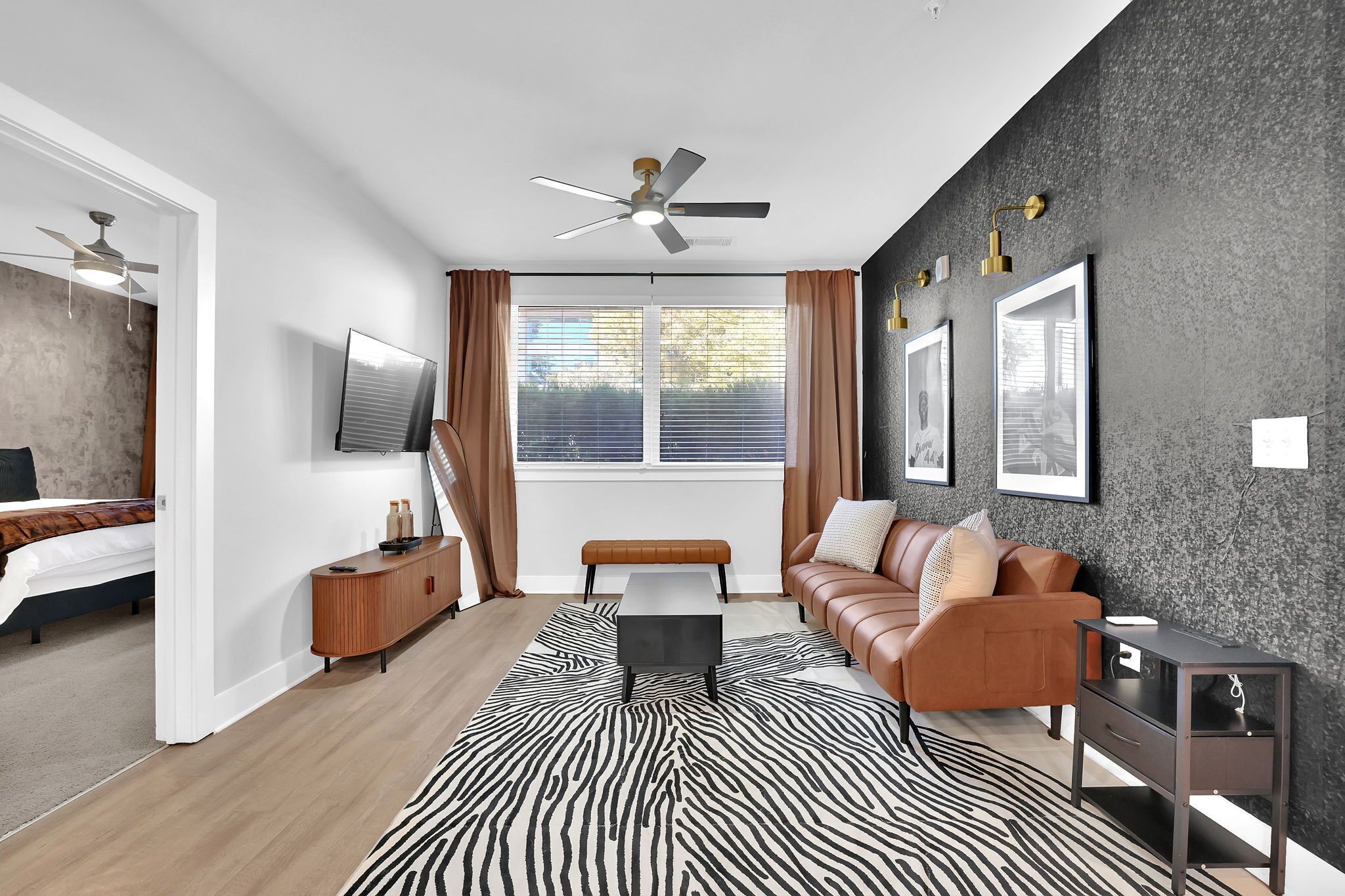 Spacious Living Room. Equipped with Smart Tv and ceiling fan