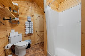 Shower, towels, soap, toilet paper