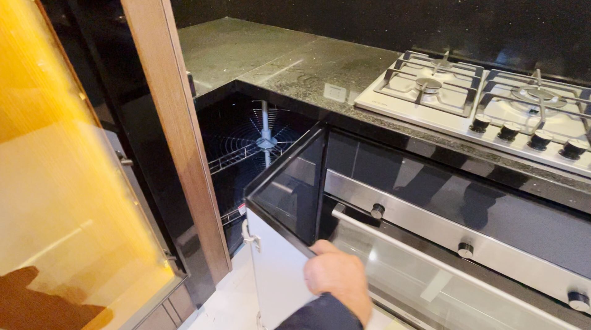 A kitchen with a stove, oven, and a microwave.