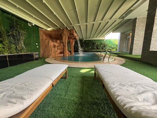 Luxury 7-Bedroom Smart House with Resort-Style Heated Pool + Waterfall + Garden