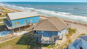 A coastal house with a balcony and a deck, situated near the beach with a view of the ocean. - Breakers Edge - Waterfront, 8 Sides of Sunshine! (Surfside Beach)