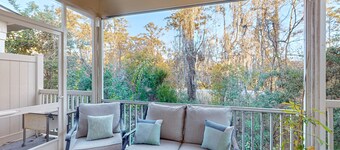 Cozy island townhouse w/screened porch, shared pool, & serene pond views