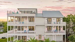 A two-story house with a pool, multiple balconies, and a white exterior. - GULF VIEWS! Game Room, Private Pool, LSV/Golf Cart, Bikes! Sleeps 24 (Rosemary Beach)
