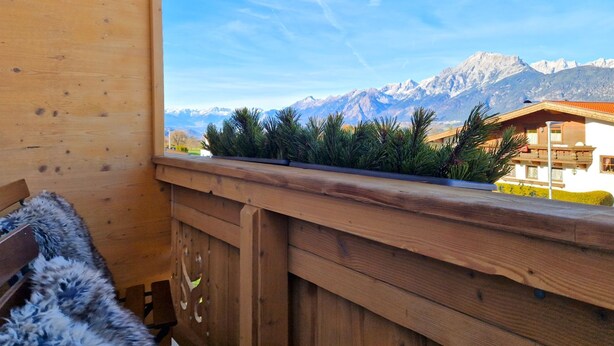 A wooden balcony with a view of snow-capped mountains. - Almluft by Interhome (Weerberg)