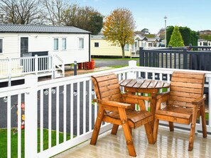 Outdoor dining - This three-bedroom lodge at Beverley Holiday Park, Paignton. (Paignton)