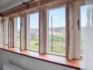 A room with a large window overlooking a rural landscape. - 2 bedroom accommodation in Diggle, Saddleworth (Diggle, Saddleworth)