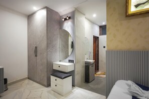 A modern bedroom with a wardrobe, vanity, and a bed. - The Forest Hills Resort (Sarada)