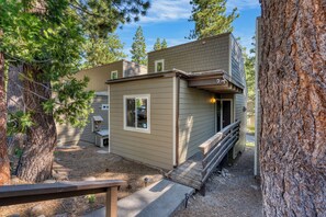 A small, single-story building with a wooden deck and a small porch. - 3 Mins to the Lake, Near Tahoe City! Modern Cabin w/ Deck Lounge | Dollar Hill (Tahoe City)