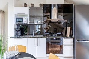 Fridge, microwave, oven, stovetop - Scandi City Loft | Balcony | Bath | AirCon (Helsinki)