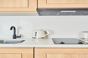 Fridge, microwave, stovetop, coffee/tea maker